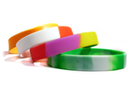 A stack of segmented blank wristbands.