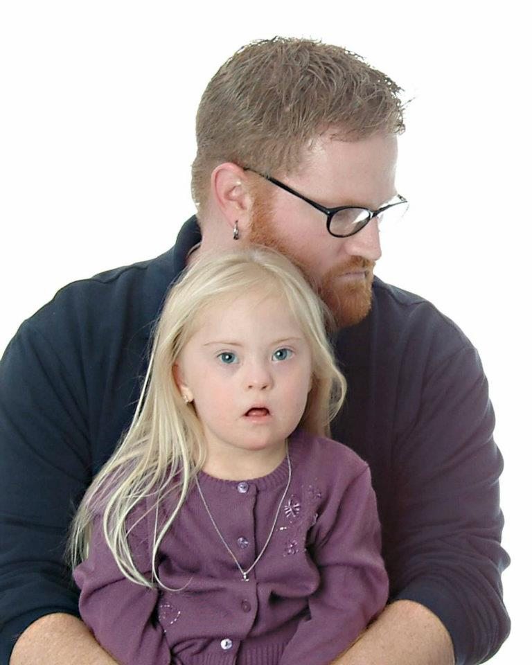 Rapid Wristbands employee with his beautiful daughter with down syndrome