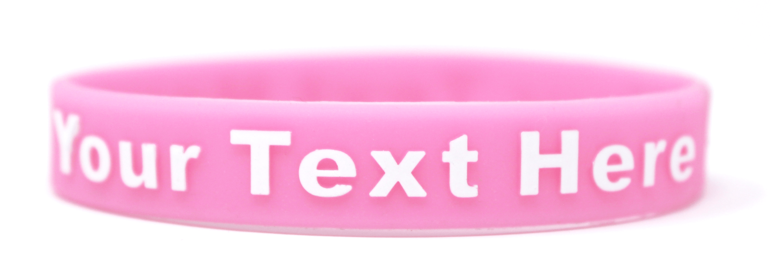 Pink wristband presents breast cancer and women's health.
