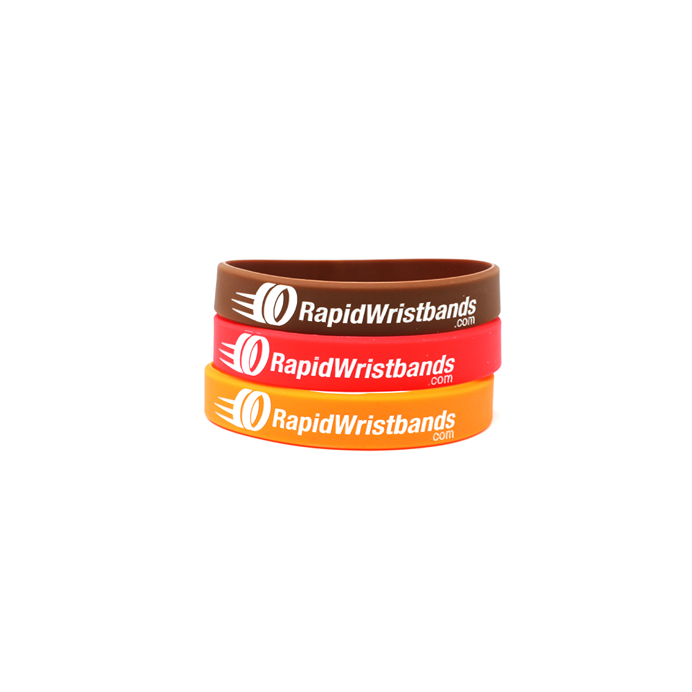 Brown, red, and orange wristband with a rapidwristband logo.